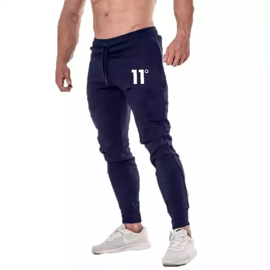 Pantalon de jogging gris pour homme avec logo "11°", coupe ajustée et taille élastique.